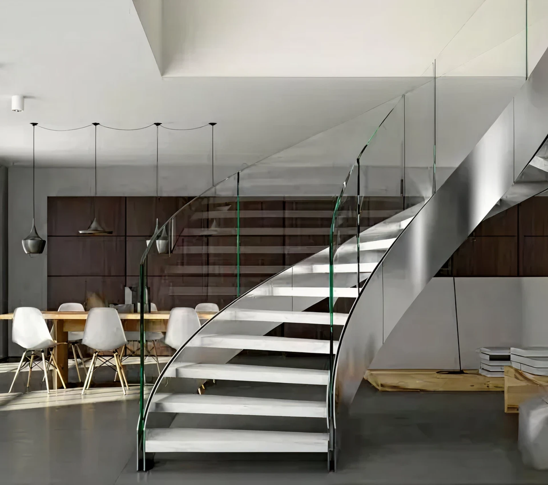 Sleek staircase beside dining area